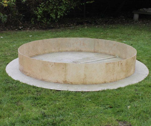 The fibreglass base pool laid on level ground before assembly