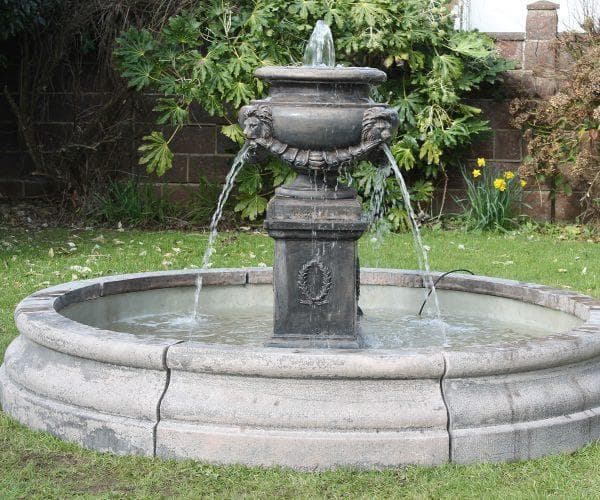 A lion urn fountain with a Romford pool surround
