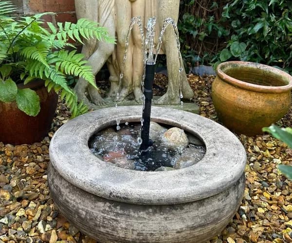 Pebble pool water fountain